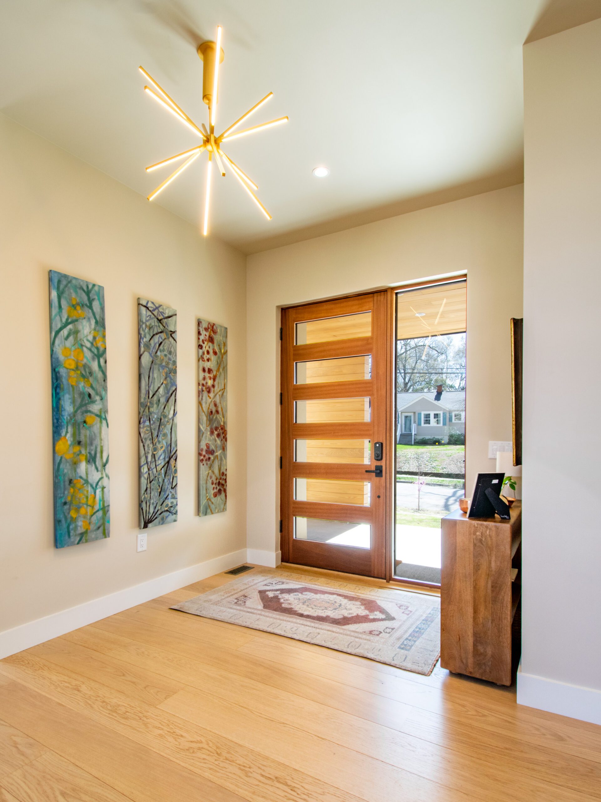 Entry foyer modern wood front door and sidelight