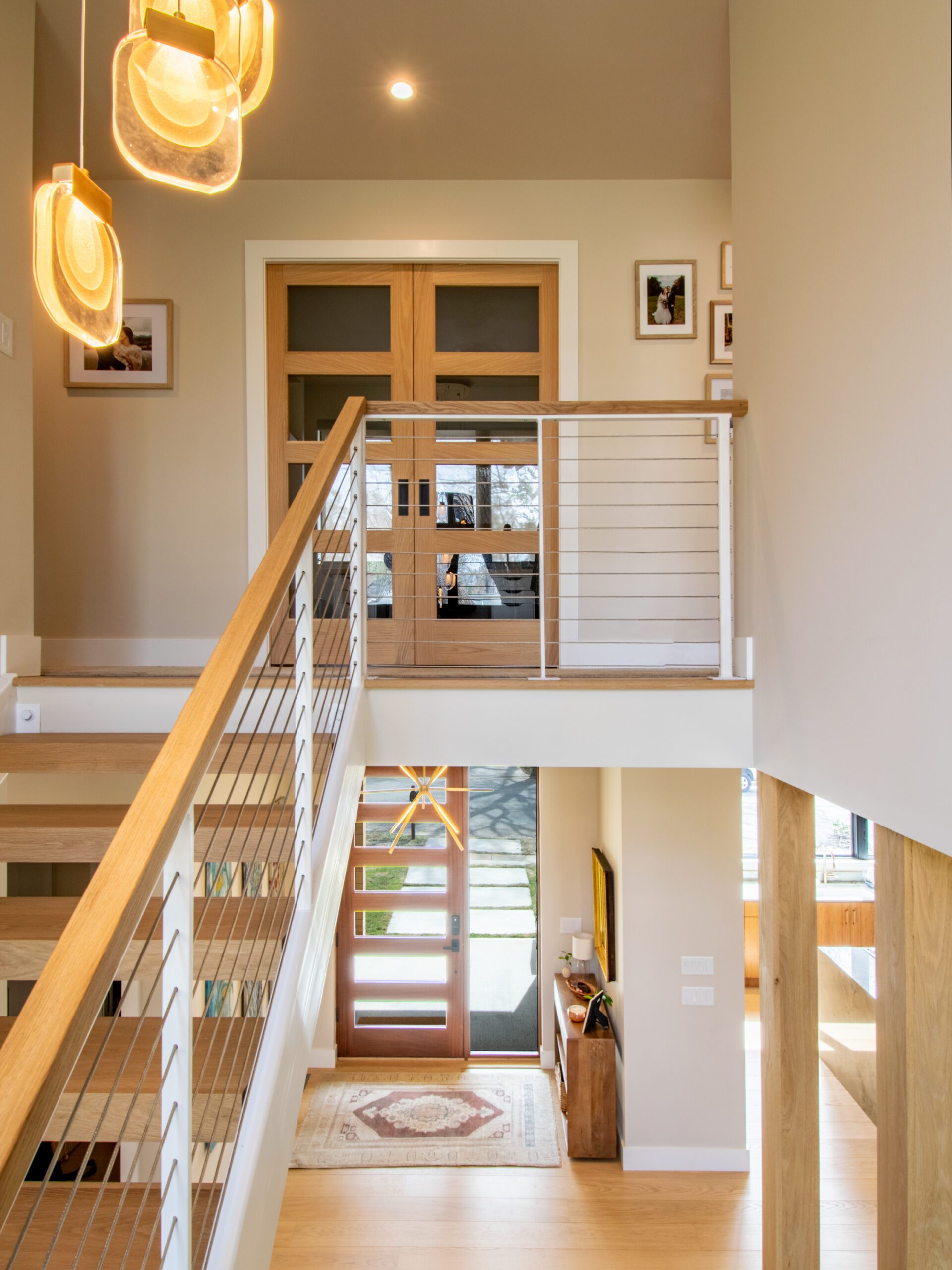 White steel stair wood handrail. Wood pocket door