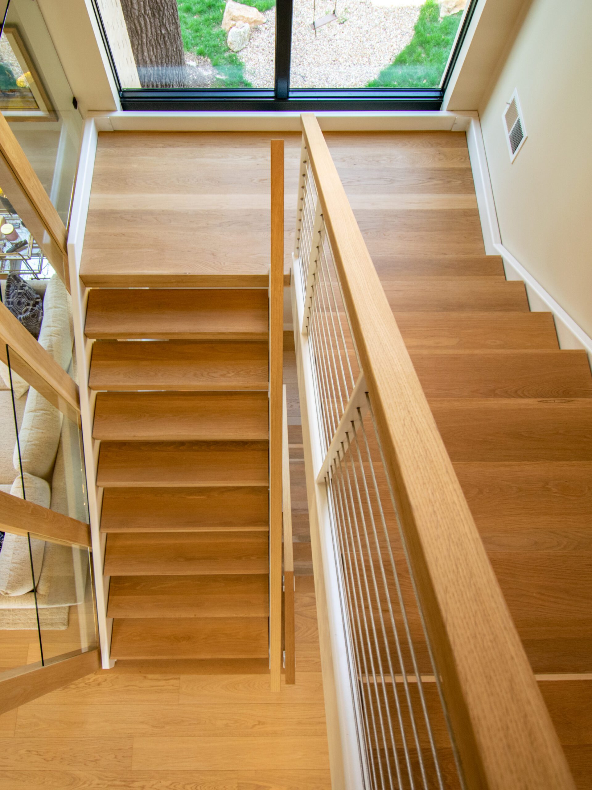 Modern stairs with white oak handrail and white oak stair treads